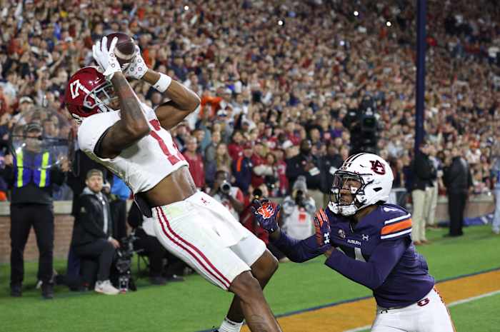 Alabama Crimson Tide wide receiver Isaiah Bond (17) scores the game winning touchdown over Auburn Tigers cornerback D.J. James (4) during the fourth quarter at Jordan-Hare Stadium.